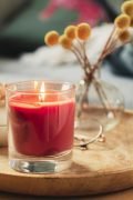 Scented candle burning on sofa table
Photo taken in natural light